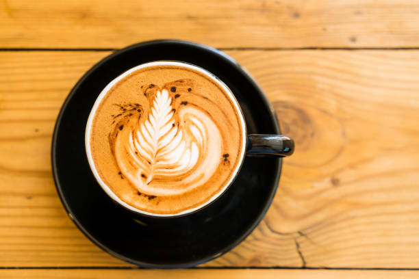 istock Hot Coffee Mocha on the brown wooden table with chocolate. 669073966