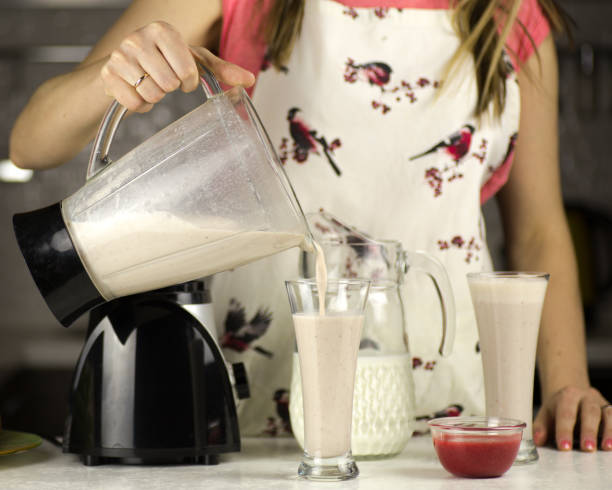 istock woman preparing a milk cocktail 669074662