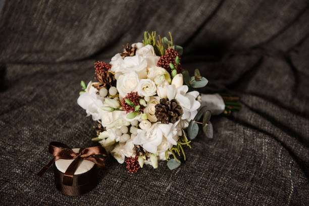 istock Stylish bridal bouquet on fabric. A box for rings. 669077776