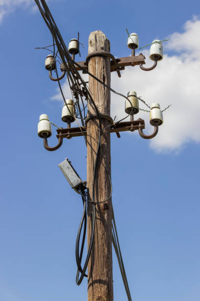 istock Wooden electrical pole with telephone lines 669078474