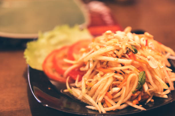 istock Appetizing and fresh Thai Papaya Salad - Thai Food Staple 669081404