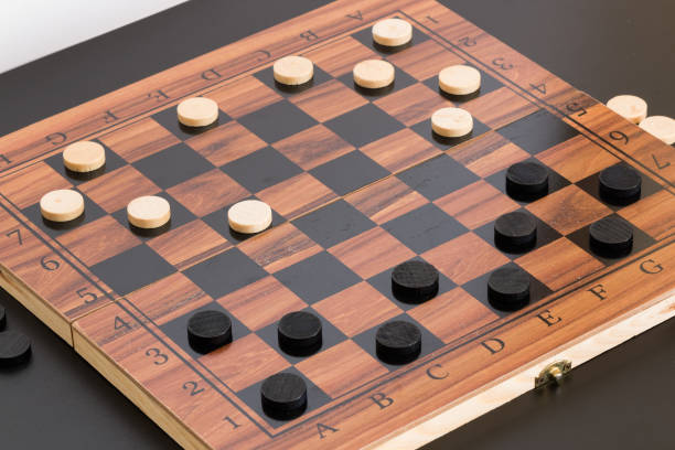 istock Tokens and lady on chessboard 669082392