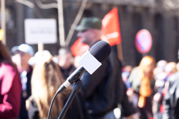 istock Political protest. Demonstration. Microphone in focus, blurred protesters in background. 669084494