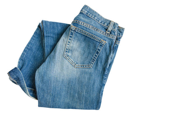 istock Blue denim jeans pants isolated on white background with copy space for text decoration, folded fashion fabric textile pants for wearing 669085188