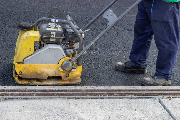 istock road repairing with vibrating compactor plate 669085310