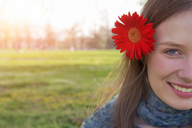 istock Beautiful woman with flower 669091410