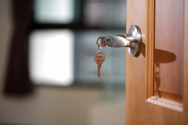 istock House key in the lock of a door 669092014