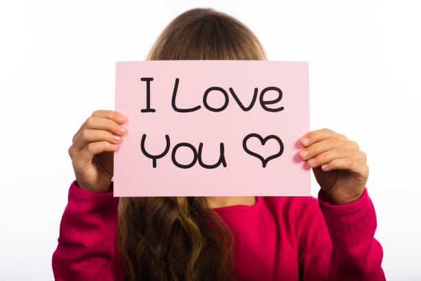 istock Child holding I Love You sign 669098086