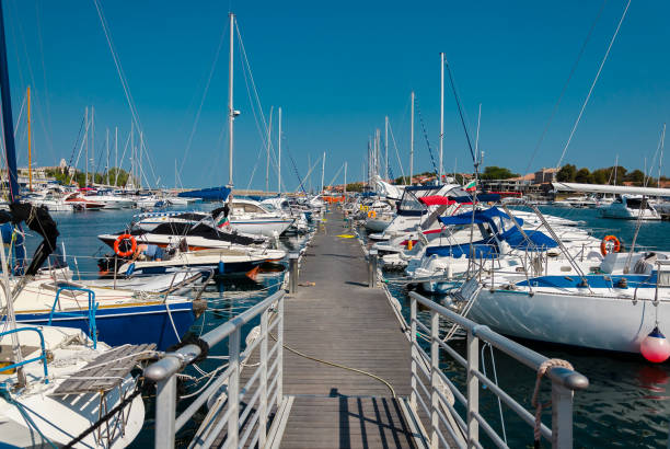 istock pier with moored boats in the port 669100580