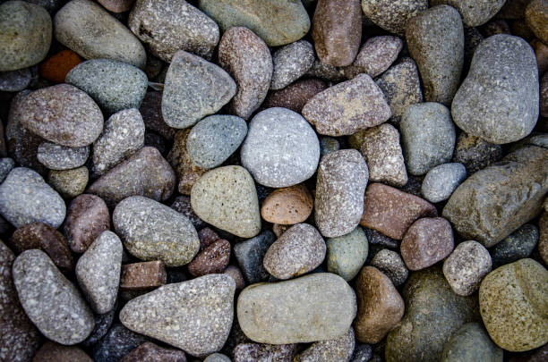 istock abstract background with dry round reeble stones 669100588
