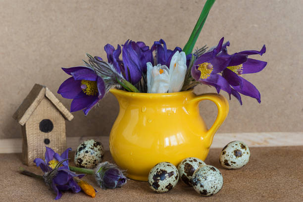 istock quail eggs and bouquet of spring flowers 669100744