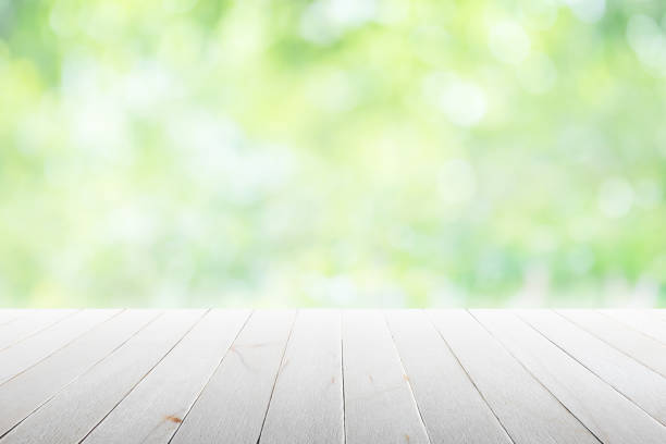 istock Empty wooden table with party in garden background blurred. 669101744