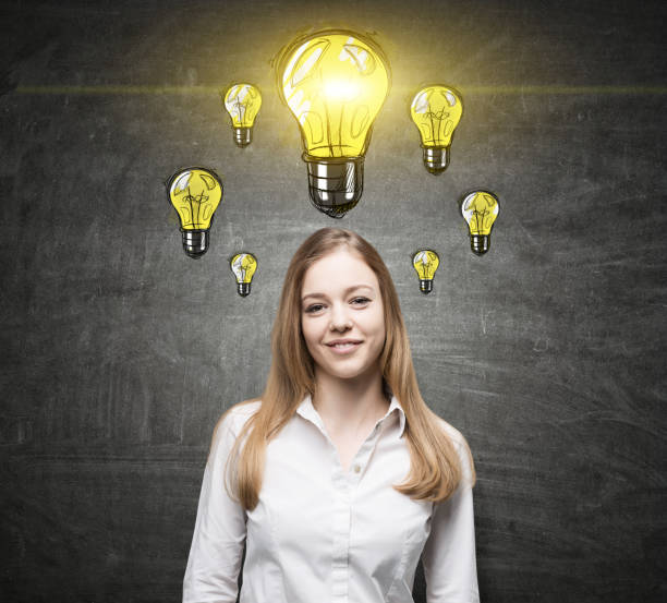 istock Smiling blond girl and many bulbs 669101746