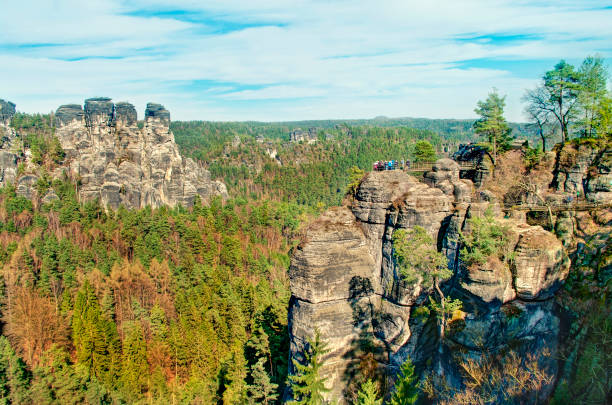 istock view of vertical rock formations surrounded by trees 669105086