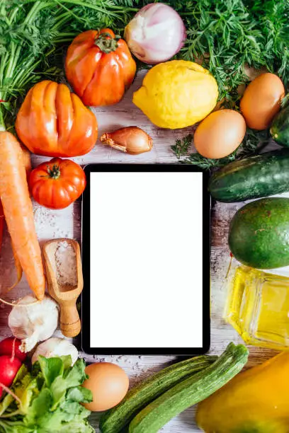 Photo of Vegetables on a white table, top view