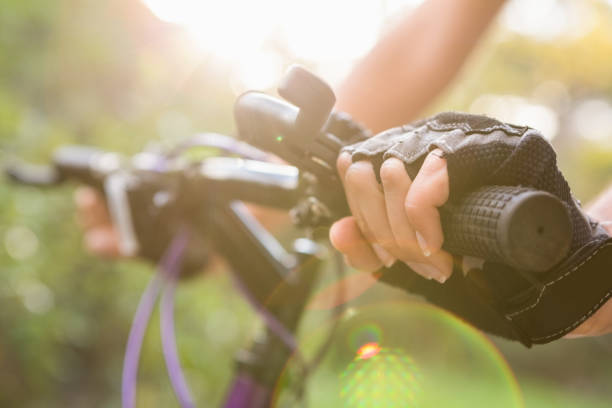 istock Woman mountain biking and holding handlebars 669111958