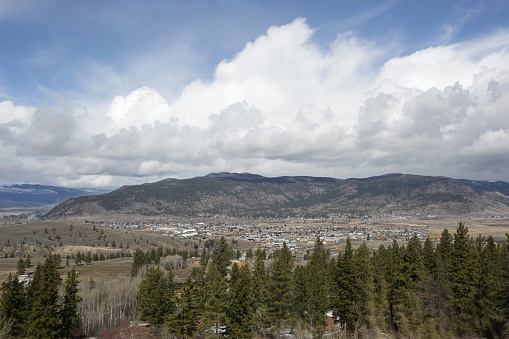 City of Merritt, British Columbia, Canada Viewed from Coquihalla Highway in Spring.  Cloudscape above the Thompson-Nicola Regional District. \n