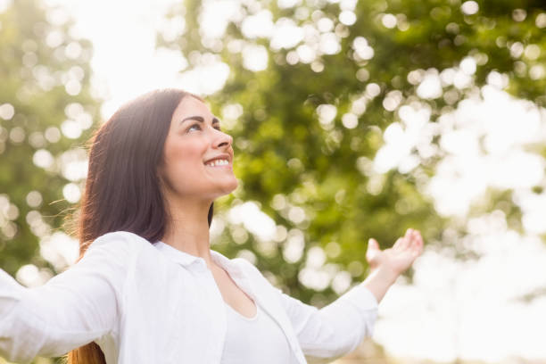 istock Beautiful brunette in the park 669112436
