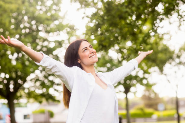 istock Beautiful brunette in the park 669112508