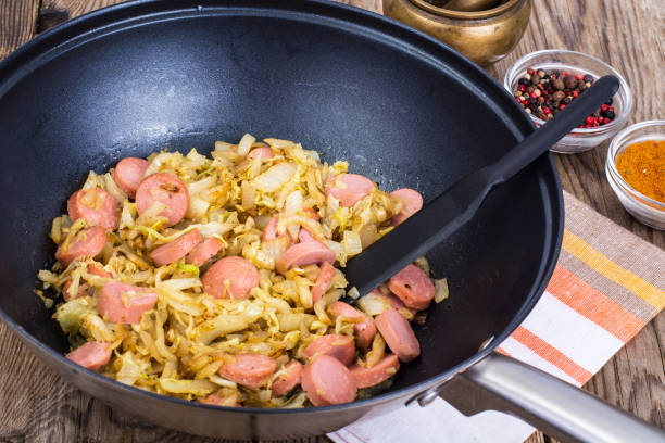 istock Sour cabbage stewed with slices of sausages 669115266