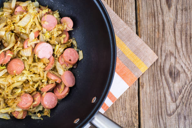 istock Sour cabbage stewed with slices of sausages 669115332