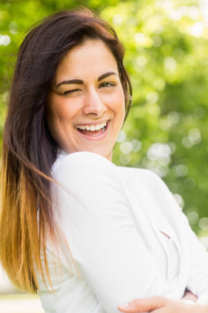 istock Beautiful brunette in the park 669115392