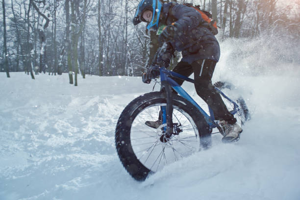 istock Man rides fat bike in the forest 669118612