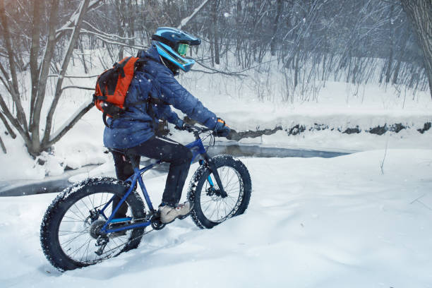 istock Man rides fat bike in the forest 669118618