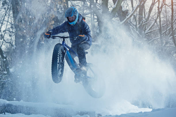 istock Man rides fat bike in the forest 669118638