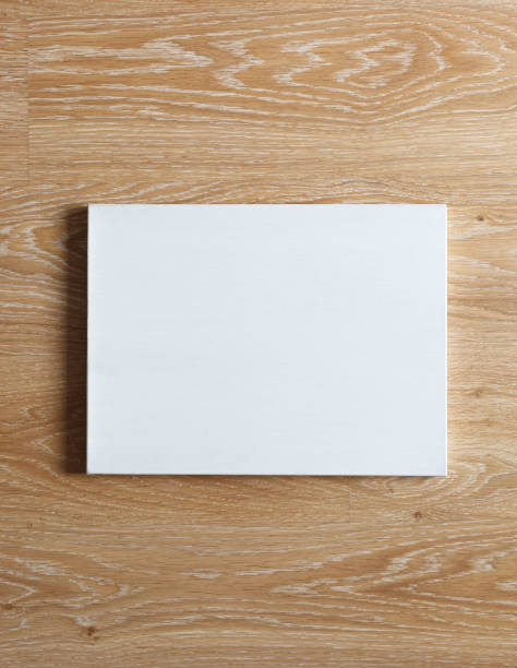 istock Blank canvas on wooden wall 669121644