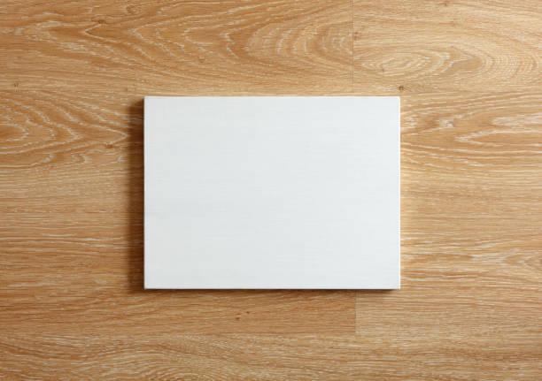 istock Blank canvas on wooden wall 669121774