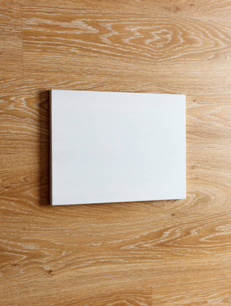 istock Blank canvas on wooden wall 669121788