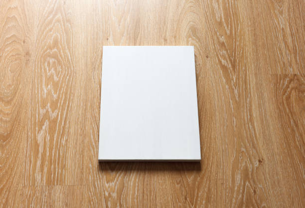istock Blank canvas on wooden wall 669121824