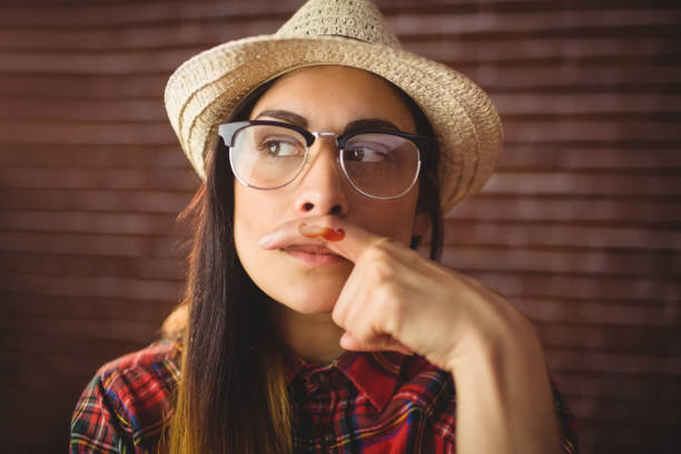 istock Beautiful hipster with mustache on finger 669128730
