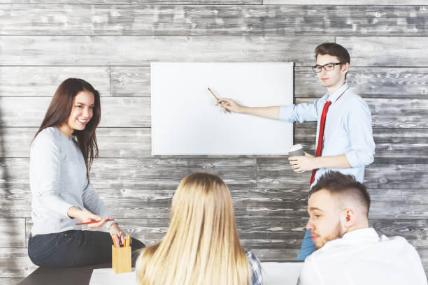 istock Handsome businessman showing whiteboard 669131552
