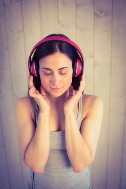 istock Pretty hipster listening to music 669135866