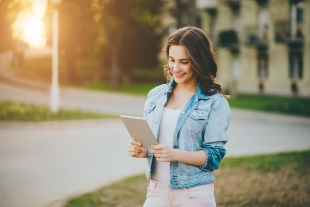 istock teenager girl using tablet 669139788