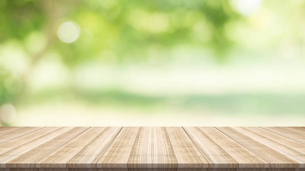 istock Emply table top on blurred nature background,Space for placing products 669146706