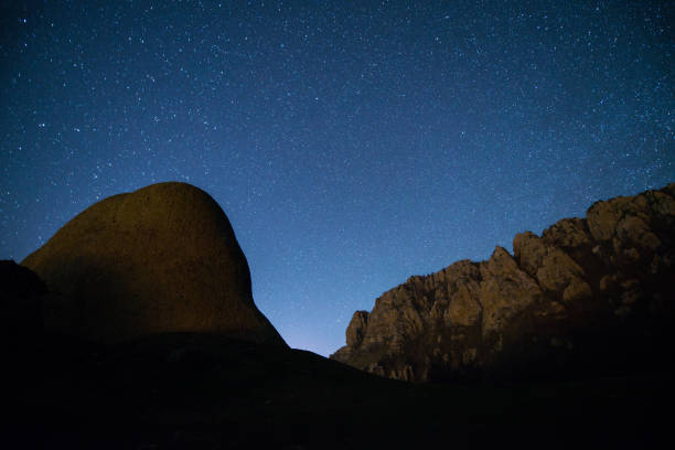 istock The starry sky above the  mountains peaks 669147456