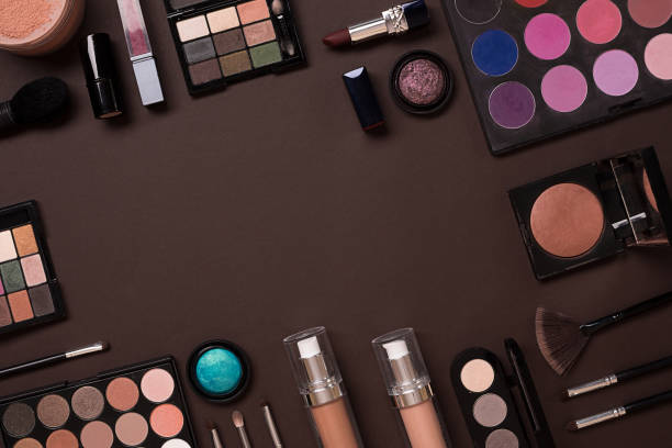 istock Top view on set of cosmetics for professional make-up on brown background 669173536