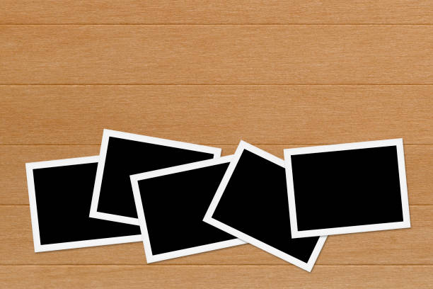 istock Blank photos on Wooden Table Background 669173812