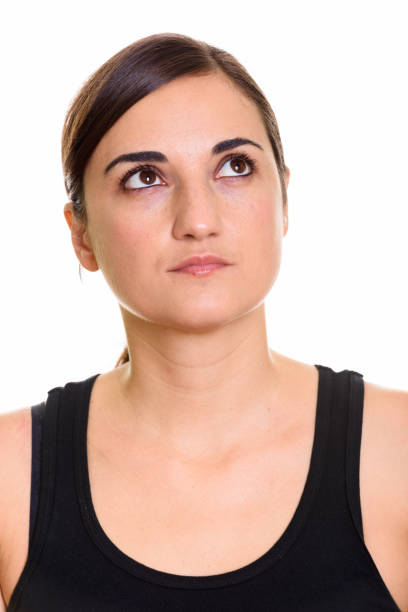 istock Face of beautiful woman thinking while looking up 669177636