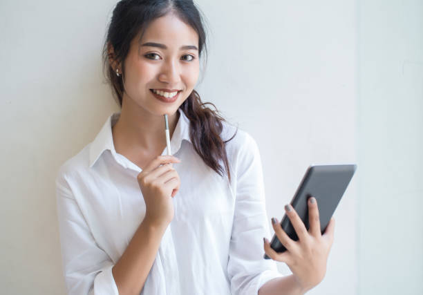 istock Beautiful young women with digital tablet 669181776