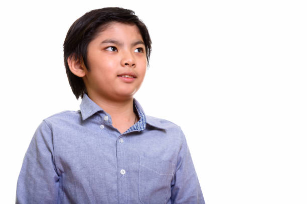 istock Studio shot of cute Japanese boy thinking 669184856