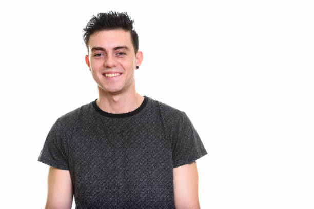istock Studio shot of happy young man smiling against white background 669187636