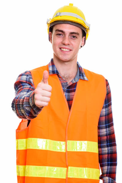 istock Studio shot of happy young man construction worker smiling while giving thumbs up 669191032