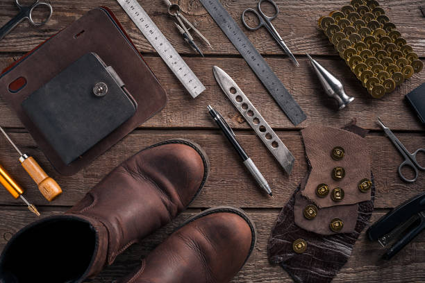 istock Leather products. Work place craftsman in a workshop. Top view 669196748
