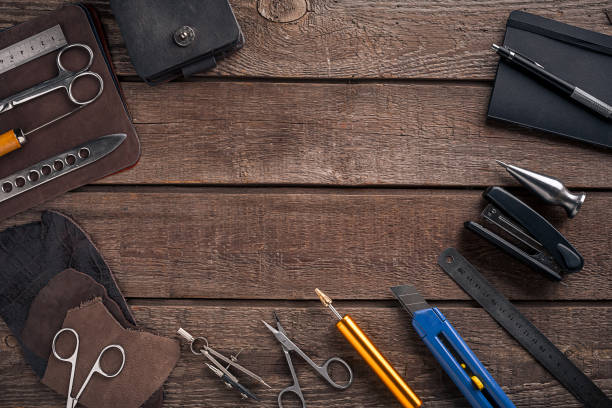 istock Leather handbag. Work place craftsman in a workshop. Top view 669197168