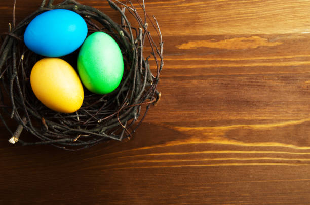 istock Easter eggs on a wooden background .Easter eggs of different colors .Easter eggs top view 669199976