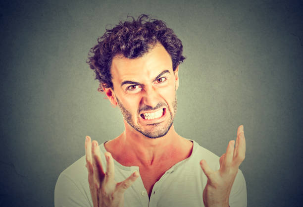 istock portrait of young angry man 669213124